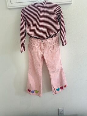 Pink corduroy trousers and stripy mock turtleneck